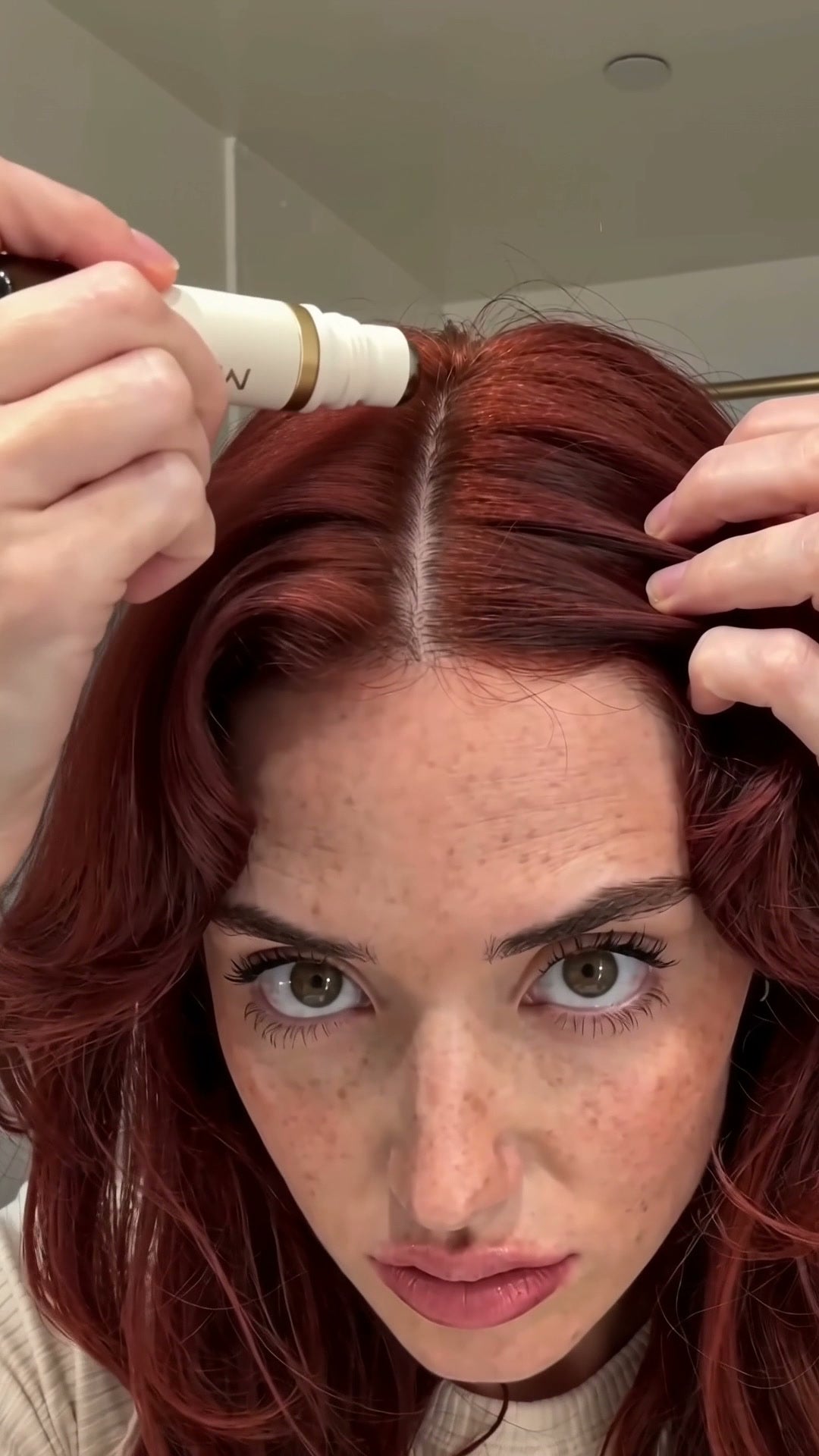 MEORI roller following an exposed red-haired scalp part
